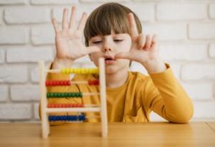 front-view-child-using-abacus-learn-how-count (1)